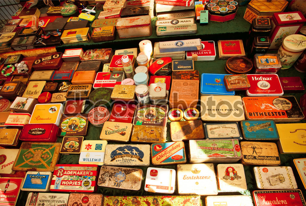 BERLIN, GERMANY - AUG 30, 2015: Set of metal tins from Cuban cigars and cigarettes on showcase of flea-market on August 30, 2015. Urban area of Berlin comprised 4 mill. people, 7th most populous in EU